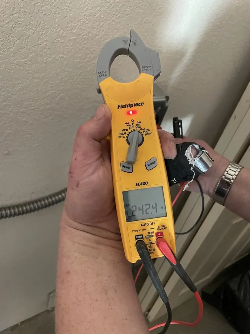 Voltage testing with clamp meter during Whole House Surge Protector in Raisinville